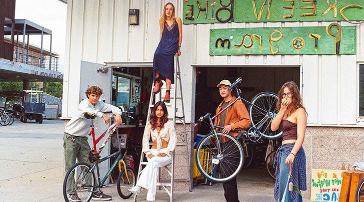 members of the pz thread5 group pose outside the green bike program building