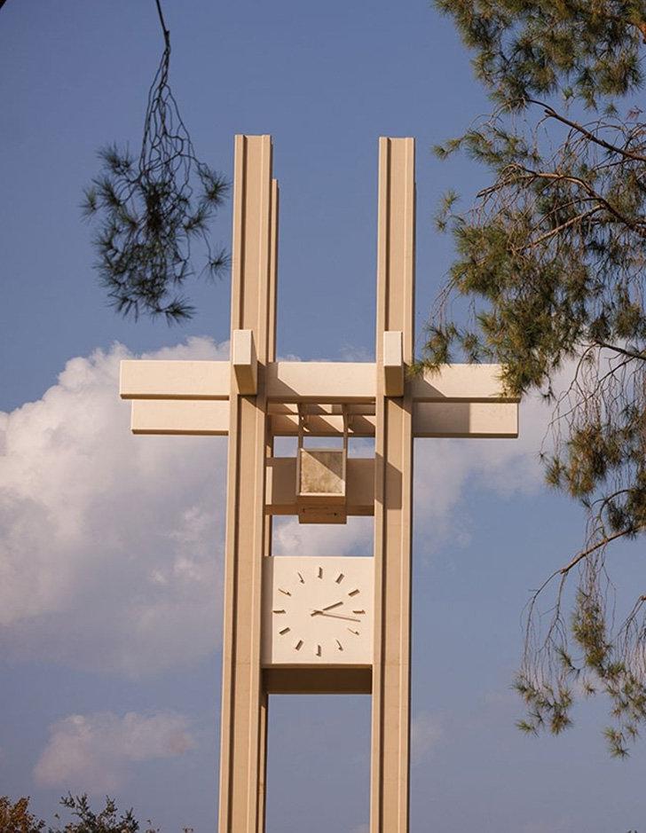 pitzer clock tower against a blue sky